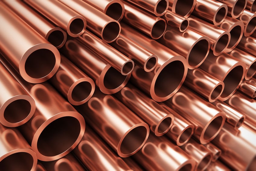 a pile of copper pipes